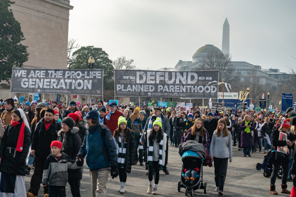 ID <a href="https://www.dreamstime.com/activists-call-defunding-planned-parenthood-washington-d-c-usa-january-pro-life-supporters-walk-holding-signs-protesting-image138160740">138160740</a> @ <a href="https://www.dreamstime.com/xascanio903_info">Xavier Ascanio</a> | <a href="https://www.dreamstime.com/stock-photos">Dreamstime.com</a>